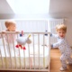 two toddler children in bedroom at home 6MXDFJZ