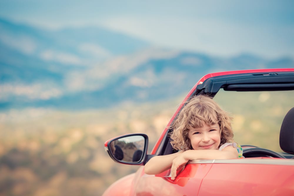Happy Child Travel By Car In The Mountains