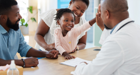 High Five, Doctor And Family With A Girl And Her Parents At The Hospital For Consulting, Appointment And Healthcare. Medicine, Trust And Support In A Medical Clinic With A Health Professional